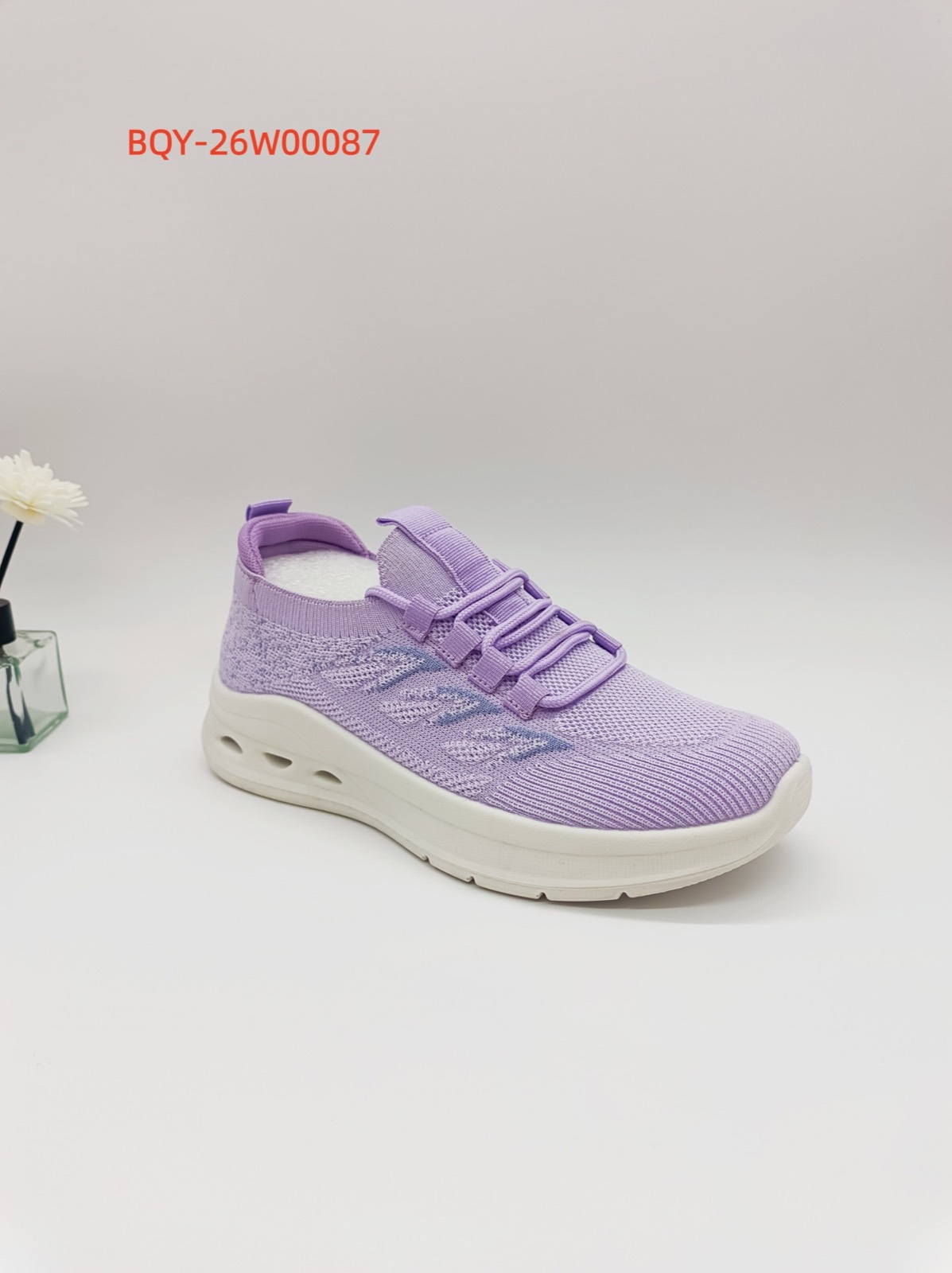 Purple knit footwear sample for regional market selection